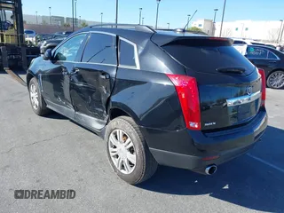 2015 Cadillac SRX z VIN 3GYFNAE32FS543933, wystawiony jako IAAI lot #41578338 z przebiegiem 150 937 mil mil oraz . Historia ofert i sprzedaży dostępna na DreamBid. Obrazek 3.