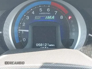 2010 Honda Insight EX with VIN JHMZE2H72AS015870, listed as a IAAI auction lot 42762384 with 58,121 mi miles and . Bid and sale history available at DreamBid. Image 7.