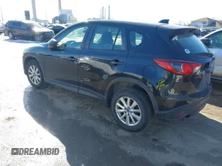 2014 Mazda CX-5 Sport with VIN JM3KE2BE7E0313978, listed as a IAAI auction lot 41437144 with 161,181 mi miles and . Bid and sale history available at carsss.com. Image 3.