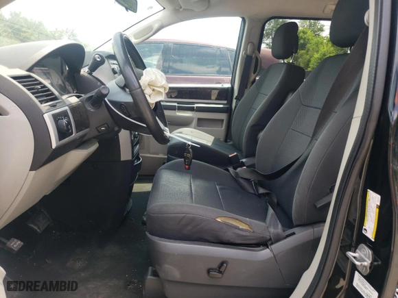 2010 Dodge Grand Caravan SXT with VIN 2D4RN5D12AR444791, listed as a Copart auction lot 77529904 with 149,676 mi miles and Salvage Title. Bid and sale history available at carsss.com. Image 7.