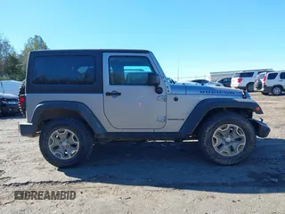 2016 Jeep Wrangler Rubicon z VIN 1C4BJWCGXGL307542, wystawiony jako IAAI lot #41407411 z przebiegiem 124 749 mil mil oraz . Historia ofert i sprzedaży dostępna na DreamBid. Obrazek 13.