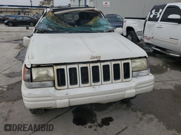 1997 Jeep Grand Cherokee Limited with VIN 1J4GX78YXVC716353, listed as a Copart auction lot 85207974 with 115,527 mi miles and Salvage Title. Bid and sale history available at carsss.com. Image 5.