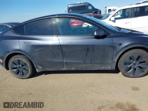 2024 Tesla Model Y with VIN 7SAYGDED8RF213796, listed as a IAAI auction lot 41634130 with 7,710 mi miles and . Bid and sale history available at DreamBid. Image 12.