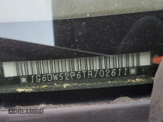 1996 Cadillac Fleetwood z VIN 1G6DW52P6TR702611, wystawiony jako Copart lot #77202664 z przebiegiem 159 994 mil mil oraz Szkody całkowita. Historia ofert i sprzedaży dostępna na DreamBid. Obrazek 12.