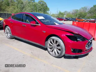 2014 Tesla Model S 60 with VIN 5YJSA1H1XEFP38289, listed as a IAAI auction lot 42092052 with 75,668 mi miles and . Bid and sale history available at DreamBid. Image 1.
