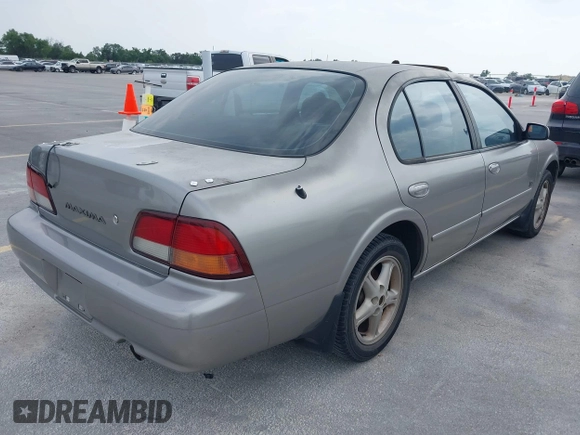 1999 Nissan Maxima GXE with VIN JN1CA21D6XT223369, listed as a IAAI auction lot 42141361 with 210,781 mi miles and . Bid and sale history available at DreamBid. Image 4.