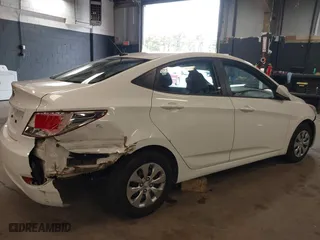 2015 Hyundai Accent GLS with VIN KMHCT4AE8FU876771, listed as a IAAI auction lot 42007229 with 63,484 mi miles. Bid and sale history available at carsss.com. Image 6.