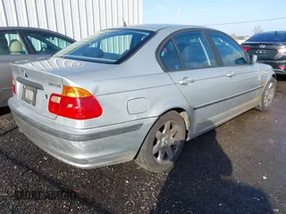 1999 BMW 3 Series 323i with VIN WBAAM3330XKC56332, listed as a IAAI auction lot 41200762 with 157,004 mi miles. Bid and sale history available at carsss.com. Image 4.