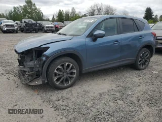 2016 Mazda CX-5 Grand Touring z VIN JM3KE4DY1G0839206, wystawiony jako Copart lot #54317885 z przebiegiem 90 888 mil mil oraz Szkoda całkowita • Salvage title. Historia ofert i sprzedaży dostępna na DreamBid. Obrazek 1.