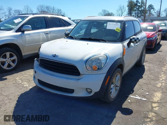 2014 MINI Countryman with VIN WMWZB3C52EWR42241, listed as a IAAI auction lot 41734963 with 121,325 mi miles and . Bid and sale history available at DreamBid. Image 2.