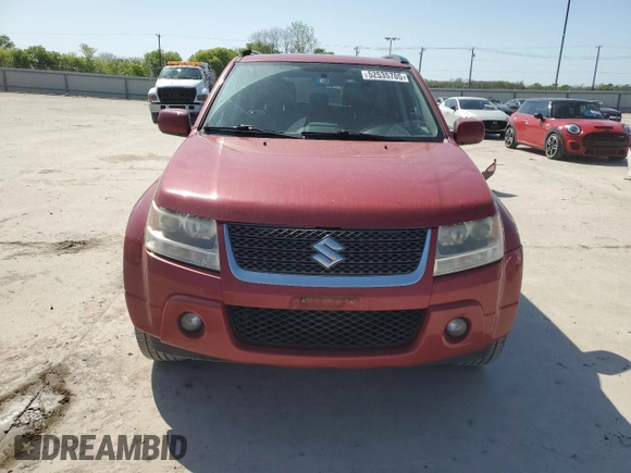 2011 Suzuki Grand Vitara Limited z VIN JS3TE0D72B4100054, wystawiony jako Copart lot #52535705 z przebiegiem 131 468 mil mil oraz Szkoda całkowita • Salvage title. Historia ofert i sprzedaży dostępna na DreamBid. Obrazek 5.