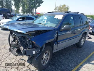 1999 Jeep Grand Cherokee Laredo z VIN 1J4G258S1XC787295, wystawiony jako IAAI lot #40450680 z przebiegiem Nie podano mil oraz . Historia ofert i sprzedaży dostępna na DreamBid. Obrazek 2.