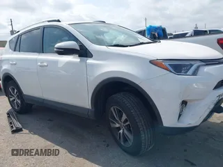 2018 Toyota RAV4 XLE z VIN 2T3WFREV6JW410848, wystawiony jako IAAI lot #42161331 z przebiegiem 113 294 mil mil oraz . Historia ofert i sprzedaży dostępna na DreamBid. Obrazek 1.