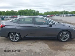 2018 Honda Clarity Touring z VIN JHMZC5F3XJC001054, wystawiony jako IAAI lot #42292688 z przebiegiem 60 780 mil mil oraz . Historia ofert i sprzedaży dostępna na DreamBid. Obrazek 13.