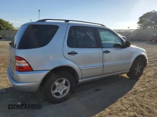 2000 Mercedes-Benz M-Class with VIN 4JGAB54E6YA181947, listed as a Copart auction lot 77781524 with 165,399 mi miles and Salvage Title. Bid and sale history available at carsss.com. Image 3.