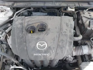 2021 Mazda 3 Premium z VIN JM1BPAML5M1402899, wystawiony jako IAAI lot #42252886 z przebiegiem Nie podano mil oraz . Historia ofert i sprzedaży dostępna na DreamBid. Obrazek 10.