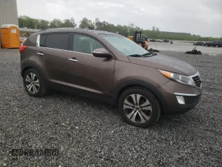 2011 Kia Sportage EX with VIN KNDPC3A2XB7080957, listed as a Copart auction lot 54665855 with 191,076 mi miles and Salvage title. Bid and sale history available at DreamBid. Image 4.