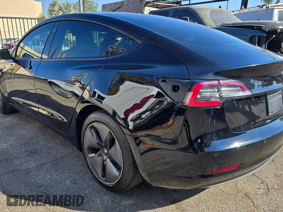 2021 Tesla Model 3 Standard Range Plus with VIN 5YJ3E1EA1MF871146, listed as a Copart auction lot 80942894 with 72,492 mi miles and Salvage Title. Bid and sale history available at DreamBid. Image 3.