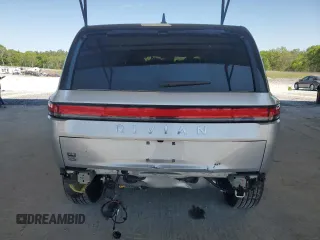 2025 Rivian R1S Adventure z VIN 7PDSGBBA9SN052652, wystawiony jako Copart lot #51659315 z przebiegiem 4012 mil mil oraz Szkody całkowita. Historia ofert i sprzedaży dostępna na DreamBid. Obrazek 6.
