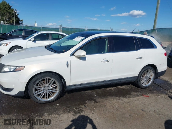 2013 Lincoln MKT EcoBoost with VIN 2LMHJ5AT8DBL55167, listed as a IAAI auction lot 41894396 with 121,114 mi miles. Bid and sale history available at carsss.com. Image 14.