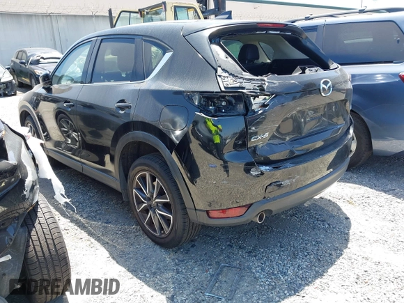 2018 Mazda CX-5 Grand Touring with VIN JM3KFADM4J0326760, listed as a IAAI auction lot 41885100 with 82,091 mi miles and . Bid and sale history available at DreamBid. Image 3.