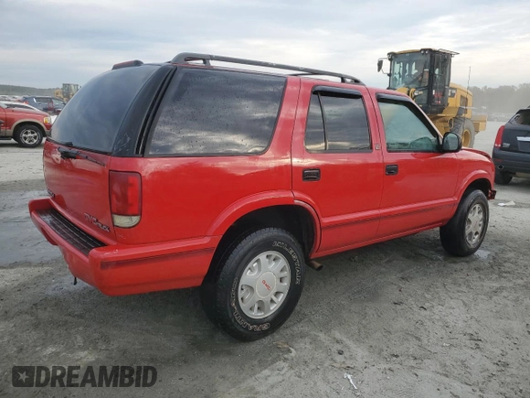 1996 GMC Jimmy SL z VIN 1GKDT13WXT2502347, wystawiony jako Copart lot #74502444 z przebiegiem 253 735 mil mil oraz Szkoda całkowita • Salvage title. Historia ofert i sprzedaży dostępna na DreamBid. Obrazek 3.