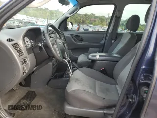 2004 Ford Escape XLS with VIN 1FMYU92104KA21454, listed as a Copart auction lot 74139564 with 217,731 mi miles and Salvage Title. Bid and sale history available at carsss.com. Image 7.
