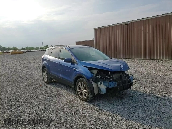 2017 Ford Escape SE z VIN 1FMCU9GD4HUD17066, wystawiony jako Copart lot #60504105 z przebiegiem 64 570 mil mil oraz Szkoda całkowita • Salvage title. Historia ofert i sprzedaży dostępna na DreamBid. Obrazek 14.