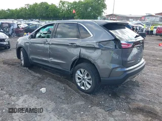 2021 Ford Edge Titanium z VIN 2FMPK3K9XMBA21766, wystawiony jako IAAI lot #42187940 z przebiegiem 79 732 mil mil oraz . Historia ofert i sprzedaży dostępna na DreamBid. Obrazek 3.