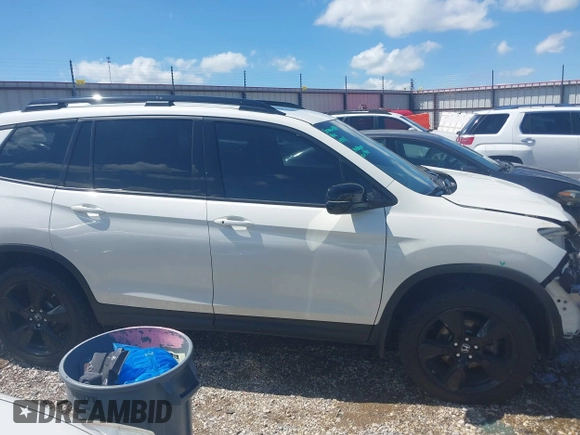 2019 Honda Passport Elite z VIN 5FNYF8H0XKB000774, wystawiony jako IAAI lot #42153669 z przebiegiem 65 415 mil mil oraz . Historia ofert i sprzedaży dostępna na DreamBid. Obrazek 13.