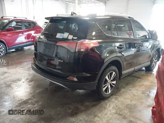 2018 Toyota RAV4 XLE with VIN 2T3WFREV1JW471931, listed as a IAAI auction lot 41332851 with 123,657 mi miles. Bid and sale history available at carsss.com. Image 4.