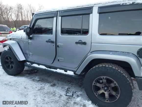 2015 Jeep Wrangler Unlimited Rubicon Hard Rock with VIN 1C4HJWFG1FL659803, listed as a IAAI auction lot 41172485 with 126,881 mi miles. Bid and sale history available at carsss.com. Image 14.