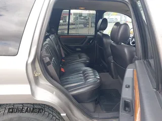 1999 Jeep Grand Cherokee Limited z VIN 1J4GW68N3XC597468, wystawiony jako IAAI lot #42353732 z przebiegiem 201 388 mil mil oraz . Historia ofert i sprzedaży dostępna na DreamBid. Obrazek 8.