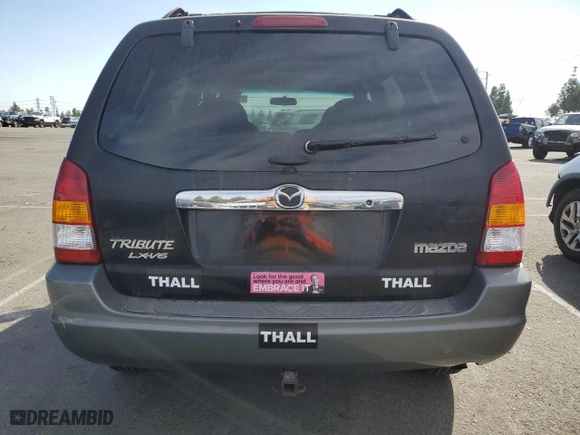 2001 Mazda Tribute LX with VIN 4F2YU09151KM38909, listed as a Copart auction lot 77808264 with 136,005 mi miles and Salvage Title. Bid and sale history available at carsss.com. Image 6.