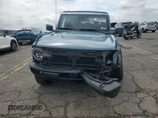2023 Ford Bronco z VIN 1FMEE5DP9PLB17477, wystawiony jako Copart lot #58829615 z przebiegiem 22 069 mil mil oraz Szkoda całkowita • Salvage title. Historia ofert i sprzedaży dostępna na DreamBid. Obrazek 5.