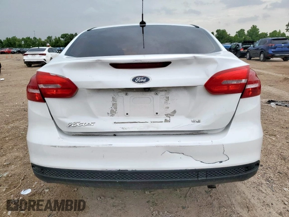 2016 Ford Focus SE with VIN 1FADP3F29GL259317, listed as a Copart auction lot 62646685 with 100,523 mi miles and Salvage title. Bid and sale history available at DreamBid. Image 6.