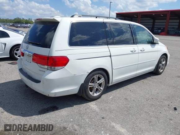 2008 Honda Odyssey Touring with VIN 5FNRL38858B006304, listed as a IAAI auction lot 41814309 with 208,778 mi miles. Bid and sale history available at carsss.com. Image 4.