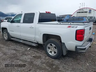 2018 Chevrolet Silverado 1500 LT with VIN 3GCUKREC0JG594914, listed as a IAAI auction lot 41735134 with 98,407 mi miles. Bid and sale history available at carsss.com. Image 3.
