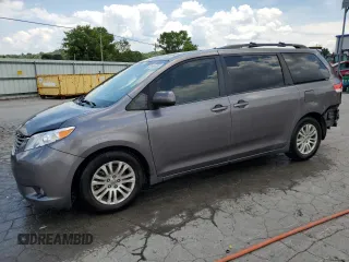 2014 Toyota Sienna XLE with VIN 5TDYK3DC6ES456558, listed as a Copart auction lot 63106085 with 231,260 mi miles and Salvage title. Bid and sale history available at DreamBid. Image 1.