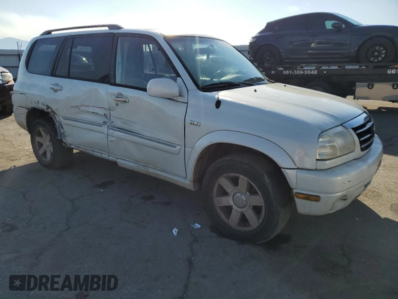 2002 Suzuki XL7 Standard z VIN JS3TX92VX24118298, wystawiony jako Copart lot #42781415 z przebiegiem 312 010 mil mil oraz Szkoda całkowita • Salvage title. Historia ofert i sprzedaży dostępna na DreamBid. Obrazek 4.