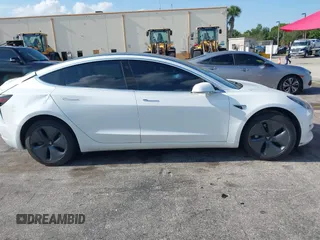 2020 Tesla Model 3 Standard Range Plus with VIN 5YJ3E1EA6LF799620, listed as a IAAI auction lot 42221643 with 55,458 mi miles and . Bid and sale history available at carsss.com. Image 12.