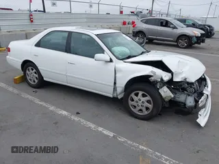 2000 Toyota Camry LE z VIN JT2BF28K3Y0289145, wystawiony jako IAAI lot #42455085 z przebiegiem 202 809 mil mil oraz . Historia ofert i sprzedaży dostępna na DreamBid. Obrazek 1.