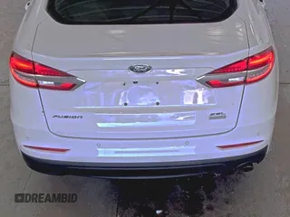 2020 Ford Fusion SEL z VIN 3FA6P0CD7LR154235, wystawiony jako IAAI lot #42556173 z przebiegiem 86 309 mil mil oraz . Historia ofert i sprzedaży dostępna na DreamBid. Obrazek 1.