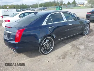 2015 Cadillac CTS Luxury AWD with VIN 1G6AX5SX5F0119102, listed as a IAAI auction lot 42231015 with 106,643 mi miles and . Bid and sale history available at DreamBid. Image 4.