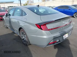 2022 Hyundai Sonata Hybrid Blue with VIN KMHL24JJ5NA037502, listed as a IAAI auction lot 40975379 with 69,018 mi miles. Bid and sale history available at carsss.com. Image 3.