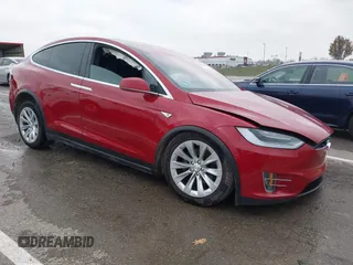 2016 Tesla Model X 70D with VIN 5YJXCBE21GF021396, listed as a IAAI auction lot 40949854 with 113,946 mi miles. Bid and sale history available at carsss.com. Image 1.