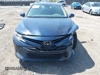 2019 Toyota Camry LE with VIN 4T1B11HK6KU276644, listed as a IAAI auction lot 42037249 with 23,677 mi miles and . Bid and sale history available at DreamBid. Image 12.