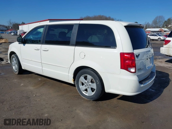 2013 Dodge Grand Caravan SE with VIN 2C4RDGBG0DR760598, listed as a IAAI auction lot 41590428 with 182,847 mi miles and . Bid and sale history available at DreamBid. Image 3.
