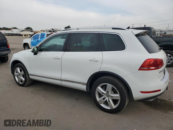 2013 Volkswagen Touareg Sport с VIN WVGEP9BP9DD003974, выставлен на аукционе Copart как лот 75106234 с пробегом 211 323 миль миль и Чистый • Clean title. История ставок и продаж доступна на DreamBid. Изображение 2.