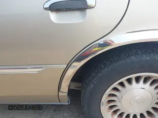 2000 Mercury Grand Marquis LS z VIN 2MEFM75W7YX729323, wystawiony jako IAAI lot #42475457 z przebiegiem 148 910 mil mil oraz . Historia ofert i sprzedaży dostępna na DreamBid. Obrazek 6.